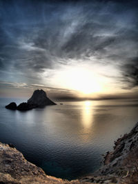 View of seascape against cloudy sky