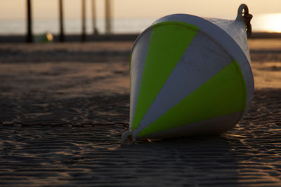 Close-up of umbrella on beach