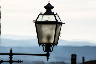 Close-up of street light against sky