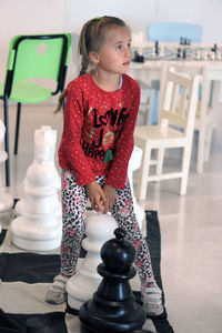 Full length of cute girl standing on floor
