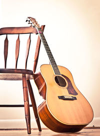 Close-up of guitar on table