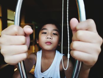 Portrait of girl holding camera