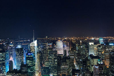 Illuminated cityscape at night