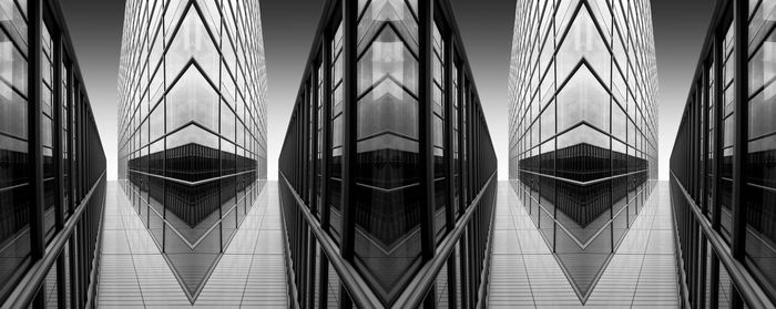 Building reflecting in water