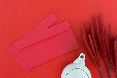 Envelopes and decorations on red background
