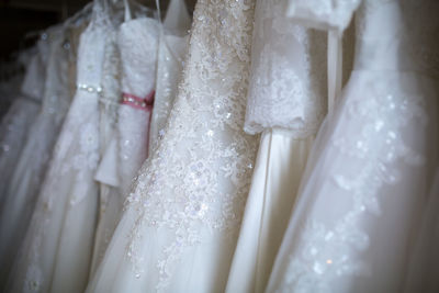 Close-up of wedding dresses in bridal shop