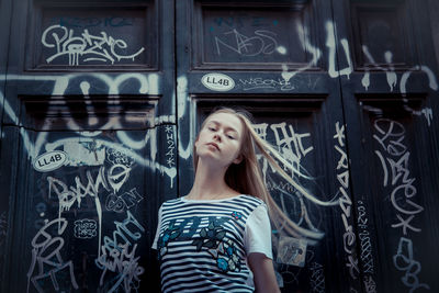 Young woman looking up