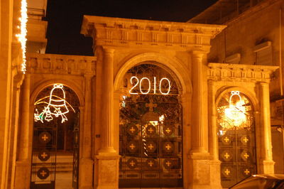 Low angle view of illuminated building at night