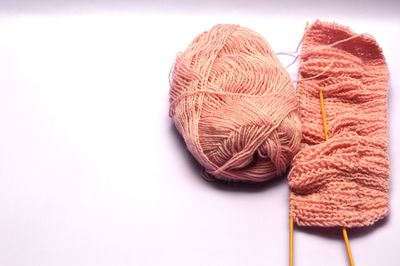 Close-up of wool on white background