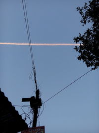 Low angle view of electricity pylon