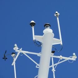 Low angle view of tower against clear blue sky