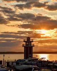 Scenic view of sea against orange sky