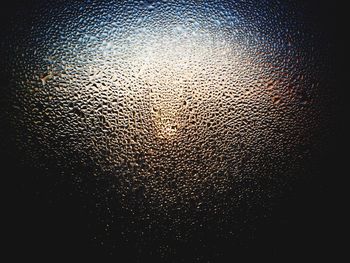 Close-up of water drops on glass