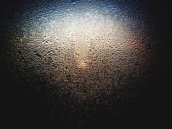 Close-up of water drops on glass