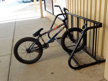 Bicycle parked against wall