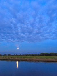 Scenic view of landscape against sky at night