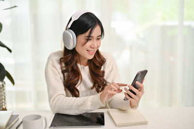 Young woman using mobile phone
