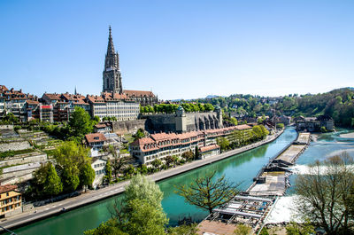 High angle view of bern minster by aare river against clear sky