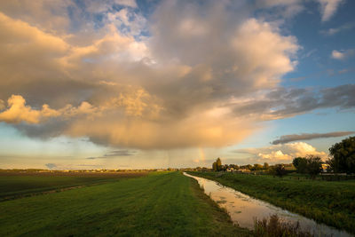 Evening autumn shower in holland illuminated by the setting sun