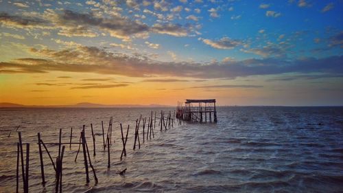 Scenic view of sea against sky at sunset