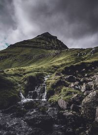 Scenic view of waterfall against sky