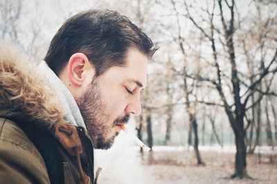 Close-up of man smoking cigarette