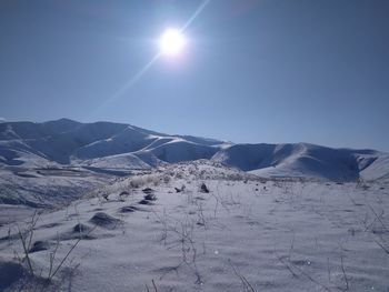 Scenic view of snowcapped mountains against sky