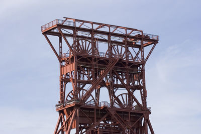 Low angle view of metal structure against sky