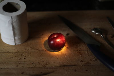 High angle view of plum on wooden table