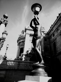 Low angle view of statue against sky in city