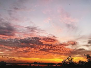 Low angle view of dramatic sky during sunset