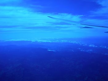 Aerial view of clouds over sea seen from airplane