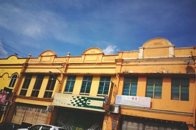 Low angle view of building against blue sky