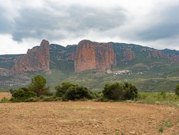 View of rock formations on landscape against sky