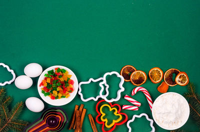 Directly above shot of christmas decorations on blue background