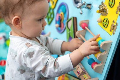 Close-up of boy playing with toy blocks