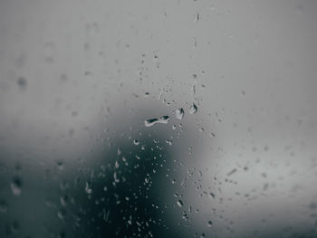 Close-up of raindrops on glass window
