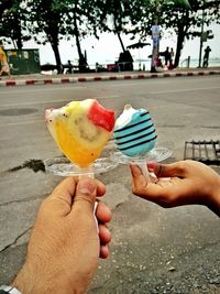 Cropped hand holding ice cream