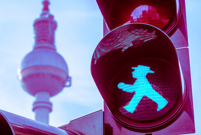 Low angle view of road signal against sky