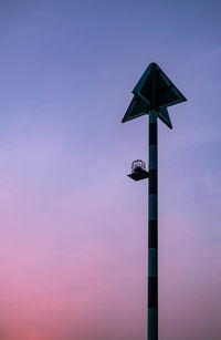 Low angle view of pole against sky during dusk