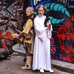 Full length of woman standing on wall