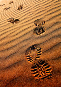 Close-up of footprints on rippled sand