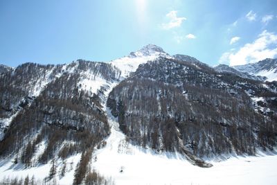 Scenic view of mountains against sky during winter