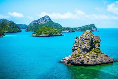 Panoramic view of rock in sea against sky