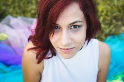 Portrait of beautiful young woman on field