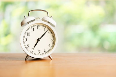 Close-up of clock on table