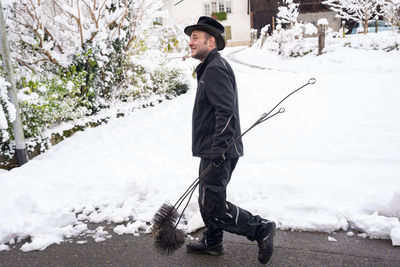 Full length of man standing on snow