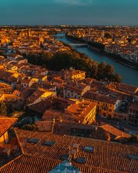 High angle view of townscape by sea against sky