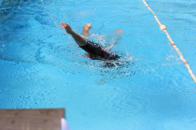 High angle view of person swimming in pool