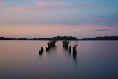 Scenic view of lake against sky during sunset